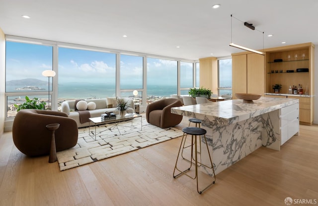 1070 Green St Unit 801, San Francisco, CA 94133 - kitchen featuring light wood-type flooring, modern cabinets, open shelves, expansive windows, and recessed lighting