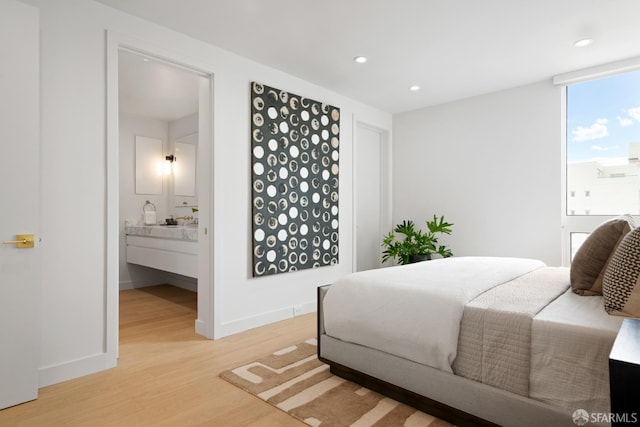 1070 Green St Unit 801, San Francisco, CA 94133 - bedroom with light wood-style floors, recessed lighting, and ensuite bath