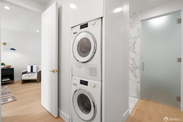 1070 Green St Unit 801, San Francisco, CA 94133 - laundry area featuring estacked washer and dryer, light wood-style floors, and recessed lighting