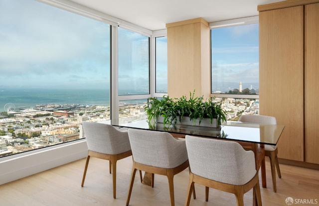 1070 Green St Unit 801, San Francisco, CA 94133 - dining area with healthy amount of natural light, floor to ceiling windows, and light wood-style flooring