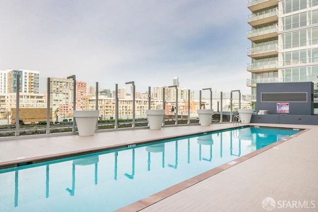 view of swimming pool with a patio