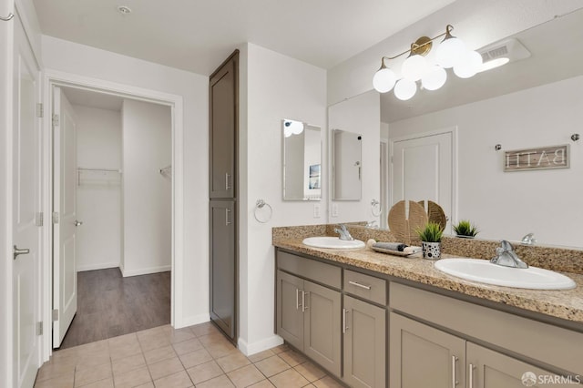 bathroom featuring tile patterned floors and vanity