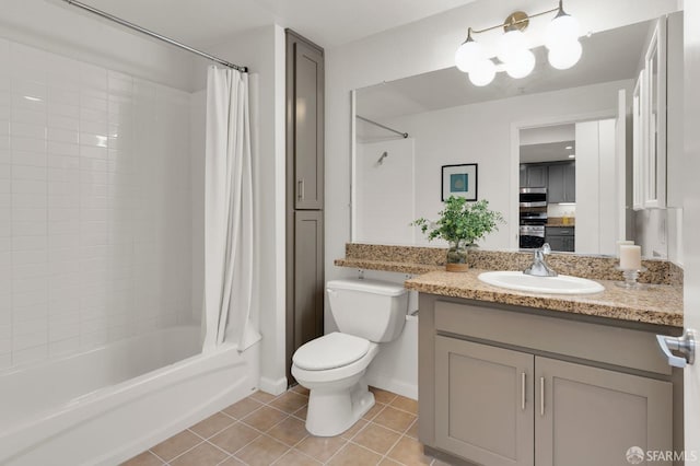 full bathroom featuring tile patterned flooring, vanity, toilet, and shower / bath combo with shower curtain