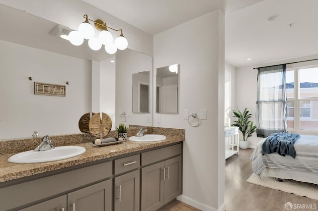 bathroom featuring vanity and hardwood / wood-style flooring