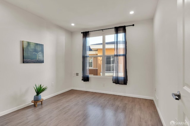 empty room with light wood-type flooring