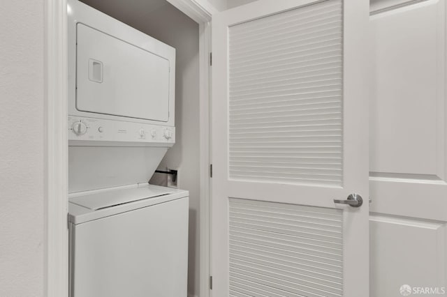 laundry room featuring stacked washing maching and dryer