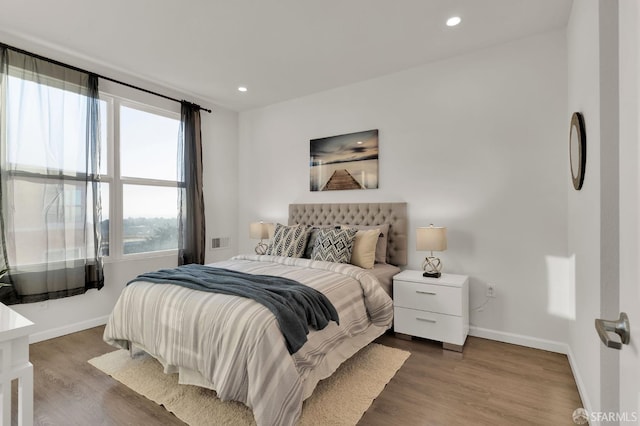 bedroom featuring dark hardwood / wood-style floors