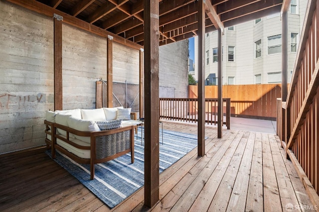 wooden deck featuring outdoor lounge area