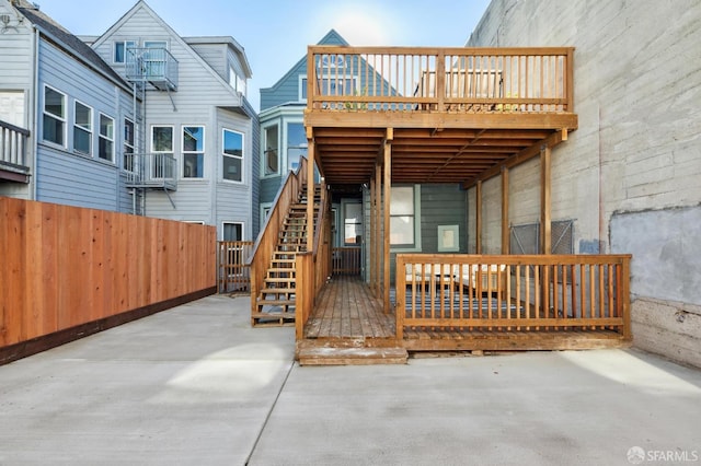 rear view of house featuring a patio area and a deck