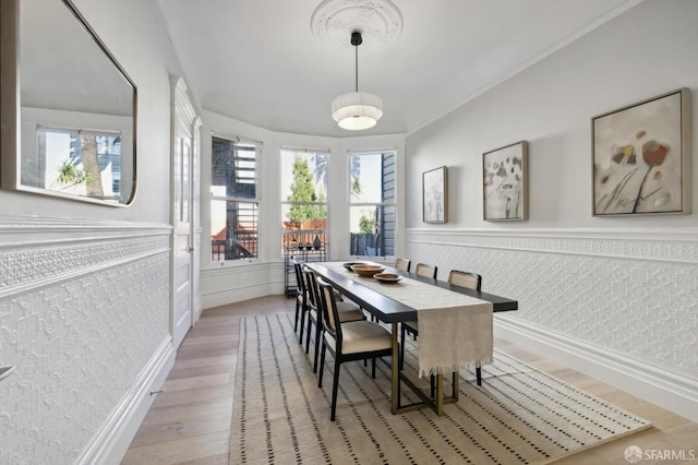 dining area with hardwood / wood-style flooring