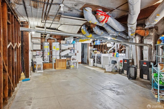 basement with separate washer and dryer, water heater, and gas water heater