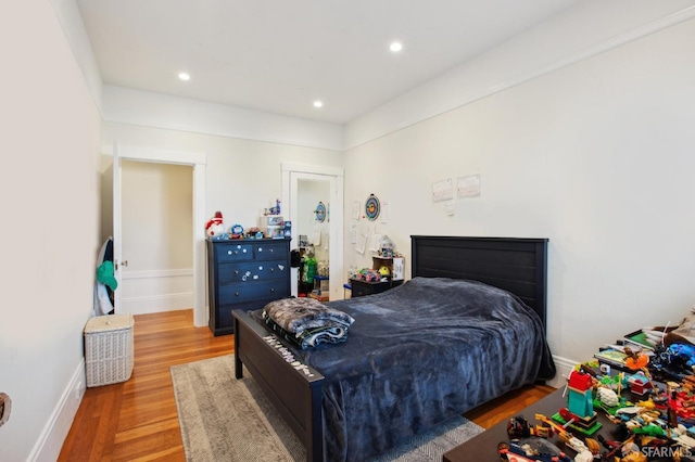 bedroom with hardwood / wood-style floors