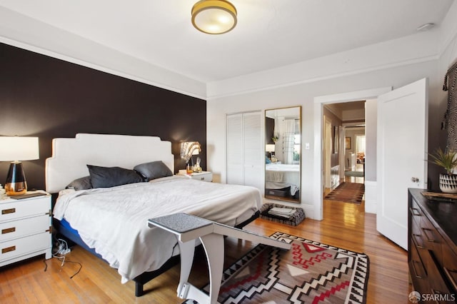 bedroom with light hardwood / wood-style flooring