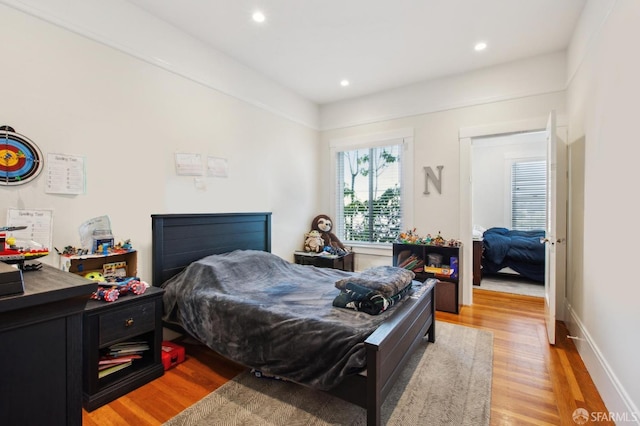 bedroom with light hardwood / wood-style floors