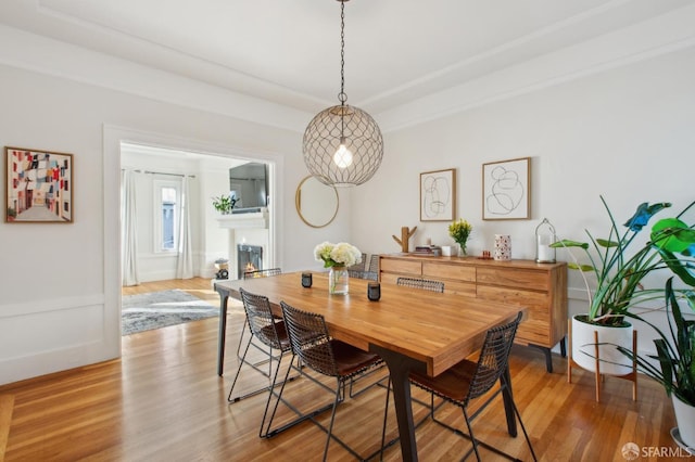 dining space featuring light wood-type flooring