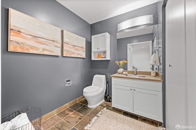 bathroom with toilet and vanity