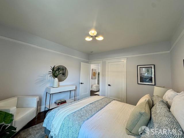 672 Prentiss St, San Francisco, CA 94110 - bedroom with a closet, wood finished floors, and baseboards