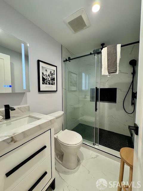 672 Prentiss St, San Francisco, CA 94110 - bathroom featuring marble finish floors, toilet, a marble finish shower, and vanity