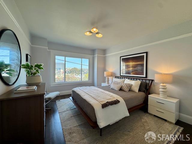 672 Prentiss St, San Francisco, CA 94110 - bedroom with baseboards and wood finished floors