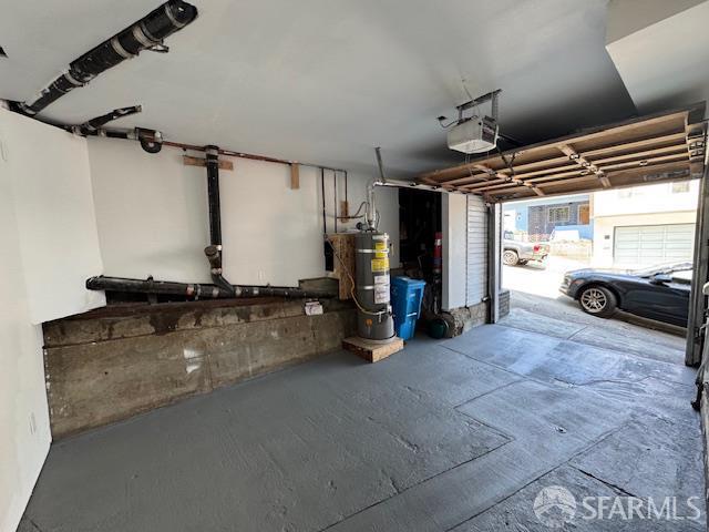 672 Prentiss St, San Francisco, CA 94110 - garage with a garage door opener and strapped water heater