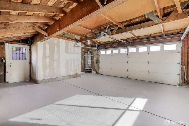 garage featuring secured water heater and a garage door opener