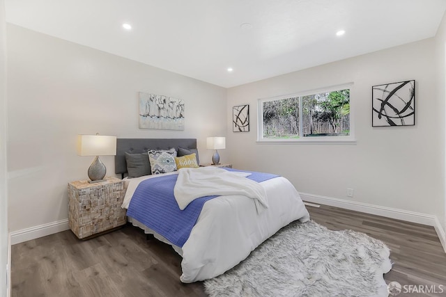 bedroom with hardwood / wood-style floors