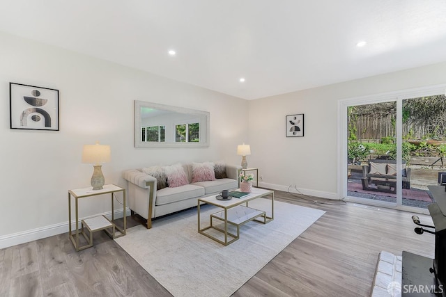 living room with light hardwood / wood-style floors