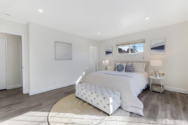 bedroom with hardwood / wood-style flooring