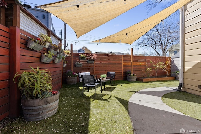 view of yard featuring a fenced backyard