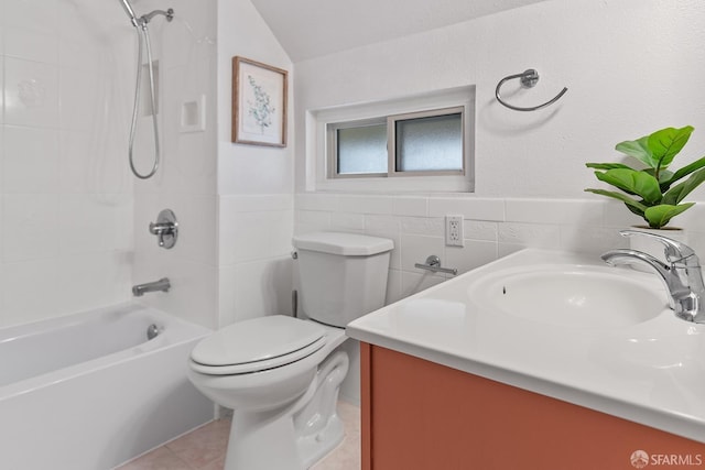 full bathroom featuring vanity, tile patterned flooring, tile walls, toilet, and shower / bathtub combination