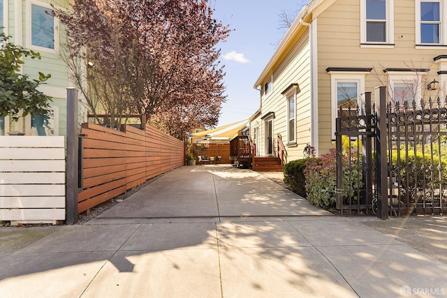 view of home's exterior featuring a gate and fence