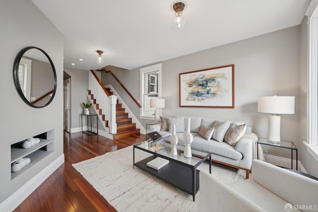 living room with dark hardwood / wood-style flooring