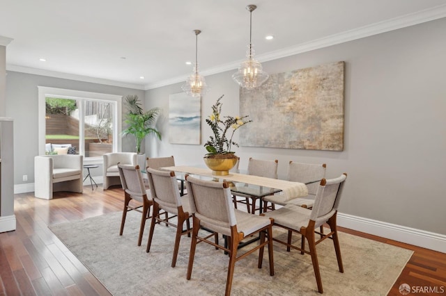 dining room featuring crown molding and wood-type flooring