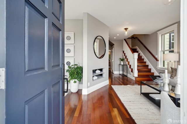 foyer with dark hardwood / wood-style floors