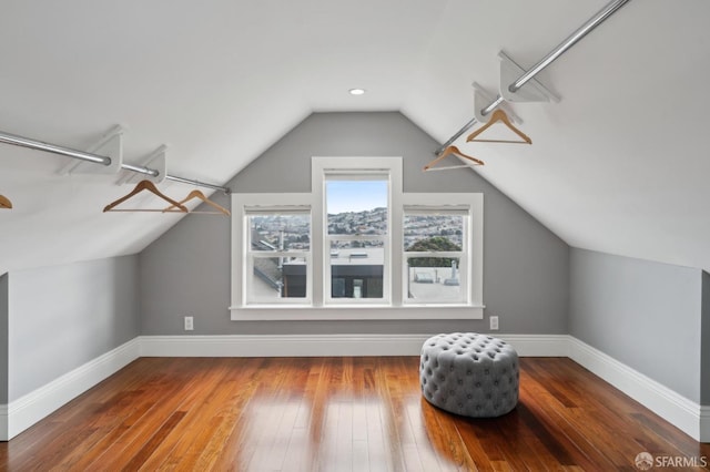 bonus room featuring hardwood / wood-style flooring and vaulted ceiling