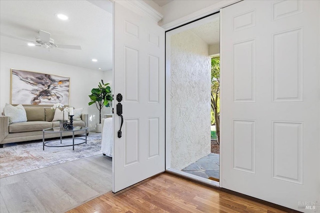 entryway with hardwood / wood-style floors, ceiling fan, and a healthy amount of sunlight