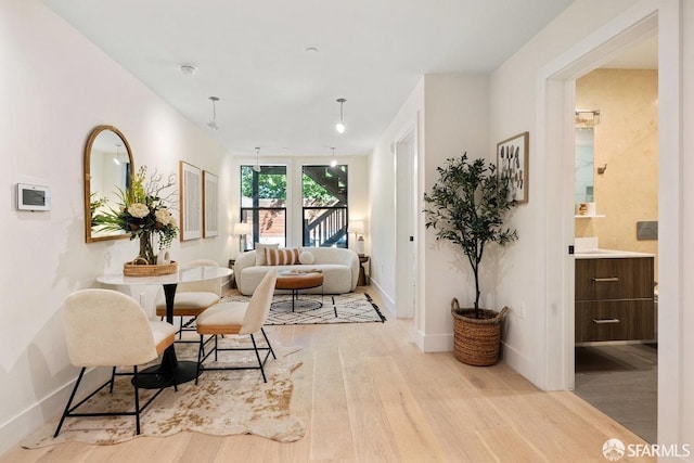 living area with light hardwood / wood-style floors