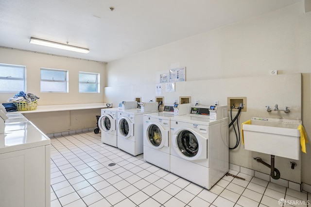 550 S Van Ness Ave Unit 306, San Francisco, CA 94110 - community laundry featuring separate washer and dryer and light tile patterned floors