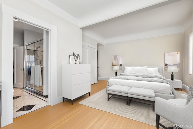 bedroom with hardwood / wood-style floors