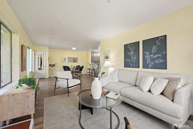 living room featuring baseboards and wood finished floors