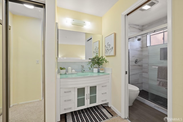 full bath with a shower stall, decorative backsplash, vanity, toilet, and visible vents