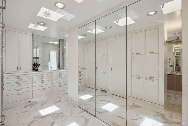 83 Mount Tiburon Rd, Tiburon, CA 94920 - full bath with vanity, recessed lighting, marble finish floors, and a skylight