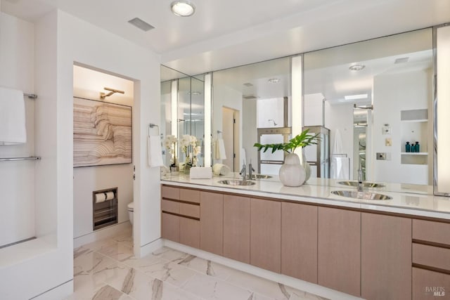 83 Mount Tiburon Rd, Tiburon, CA 94920 - bathroom with double vanity and marble look tiles