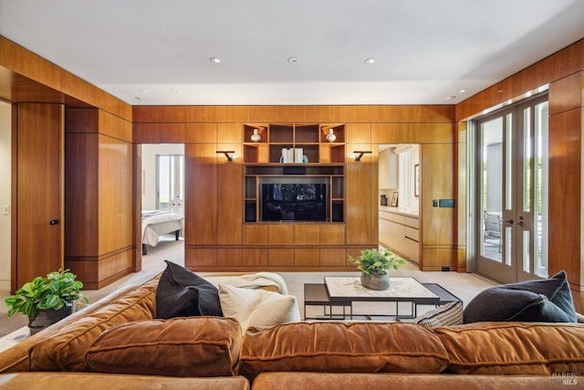 83 Mount Tiburon Rd, Tiburon, CA 94920 - living room featuring plenty of natural light, wooden walls, french doors, light colored carpet, and recessed lighting