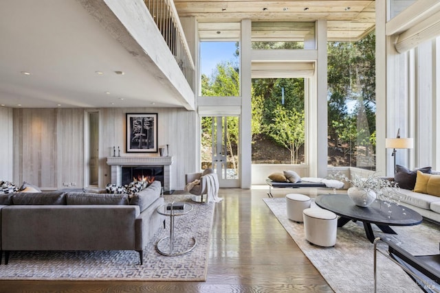 83 Mount Tiburon Rd, Tiburon, CA 94920 - living room with a warm lit fireplace, wood finished floors, and french doors