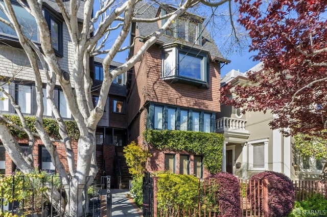 view of front of home with fence