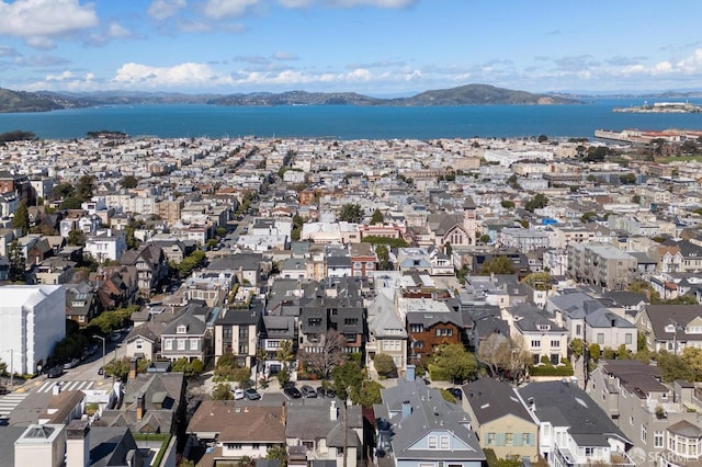 aerial view with a residential view and a water and mountain view