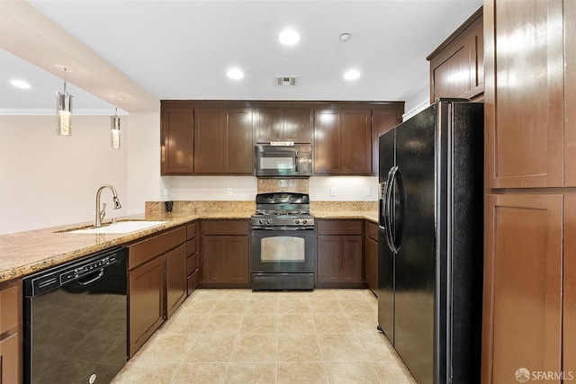 kitchen featuring recessed lighting, visible vents, a sink, light stone countertops, and black appliances