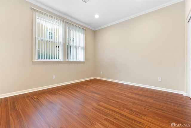 unfurnished room with crown molding, baseboards, wood finished floors, and recessed lighting