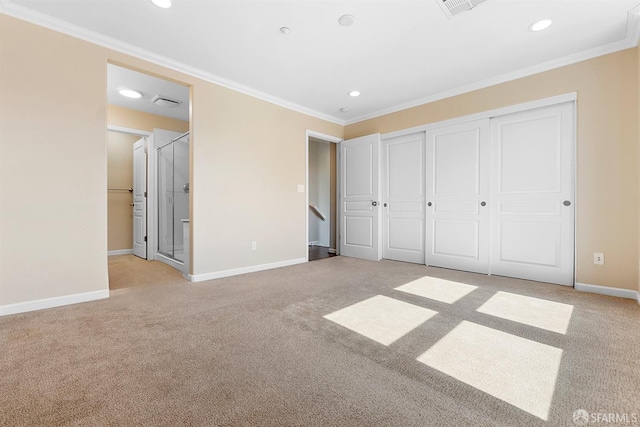 unfurnished bedroom featuring light carpet, baseboards, and crown molding